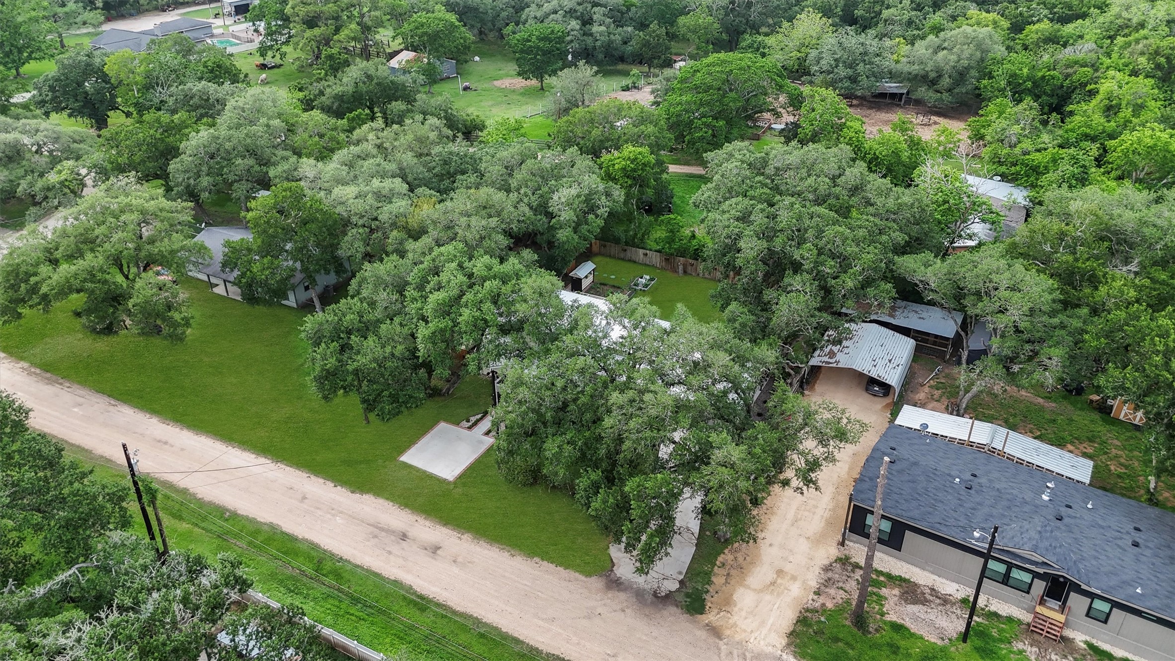 35 Bounty Palacios, TX 77465 - Photo 33 of 35 an aerial view of a house with a yard and outdoor seating