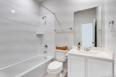 a view of house with backyard and garage