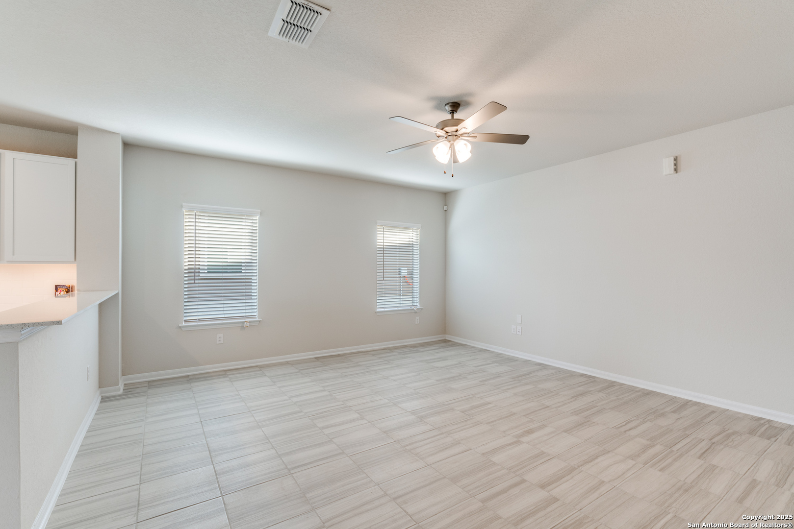 8931 Hazel Birch Elmendorf, TX 78112 - Photo 6 of 21 wooden floor in an empty room with a window