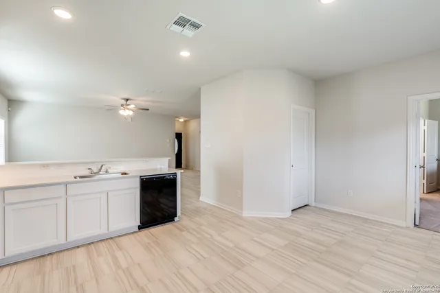 a view of a kitchen with a sink and dishwasher kitchen view