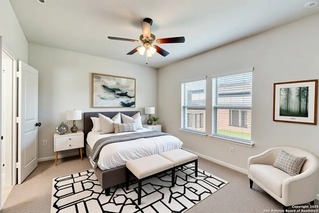 a bedroom with a bed and a couch