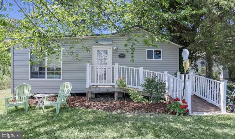 20805 Severn Road Ewell, MD 21824 - Photo 1 of 27 a view of a house with backyard and sitting area