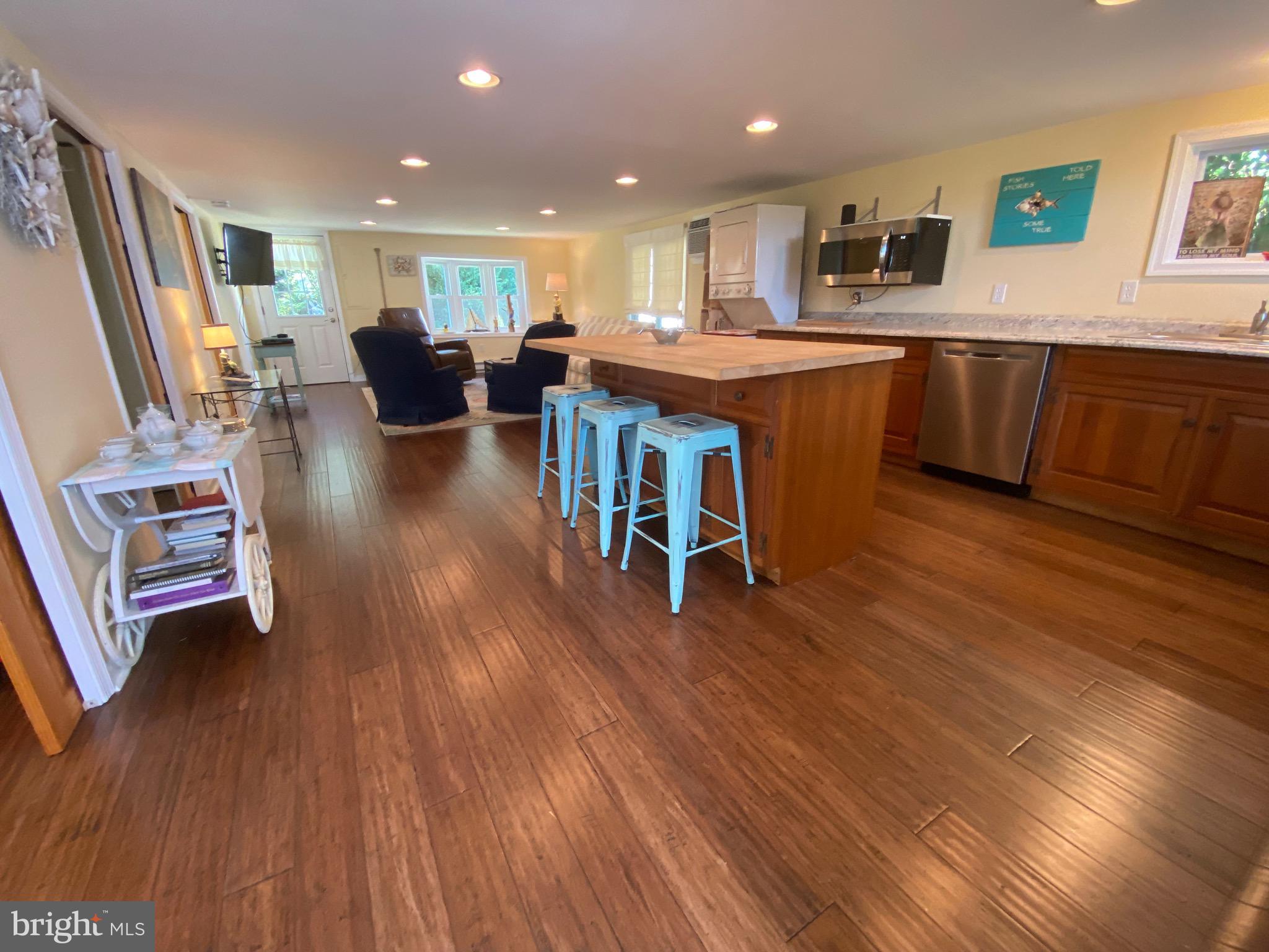 20805 Severn Road Ewell, MD 21824 - Photo 14 of 27 a open kitchen with wooden floors and a sink
