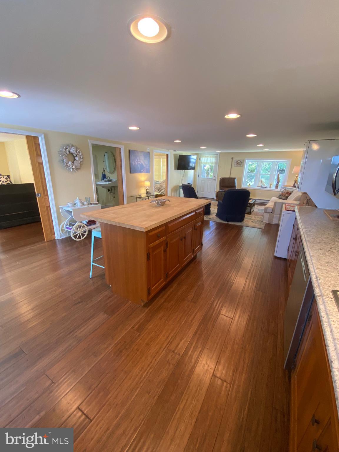 20805 Severn Road Ewell, MD 21824 - Photo 16 of 27 a living room with furniture and a wooden floor