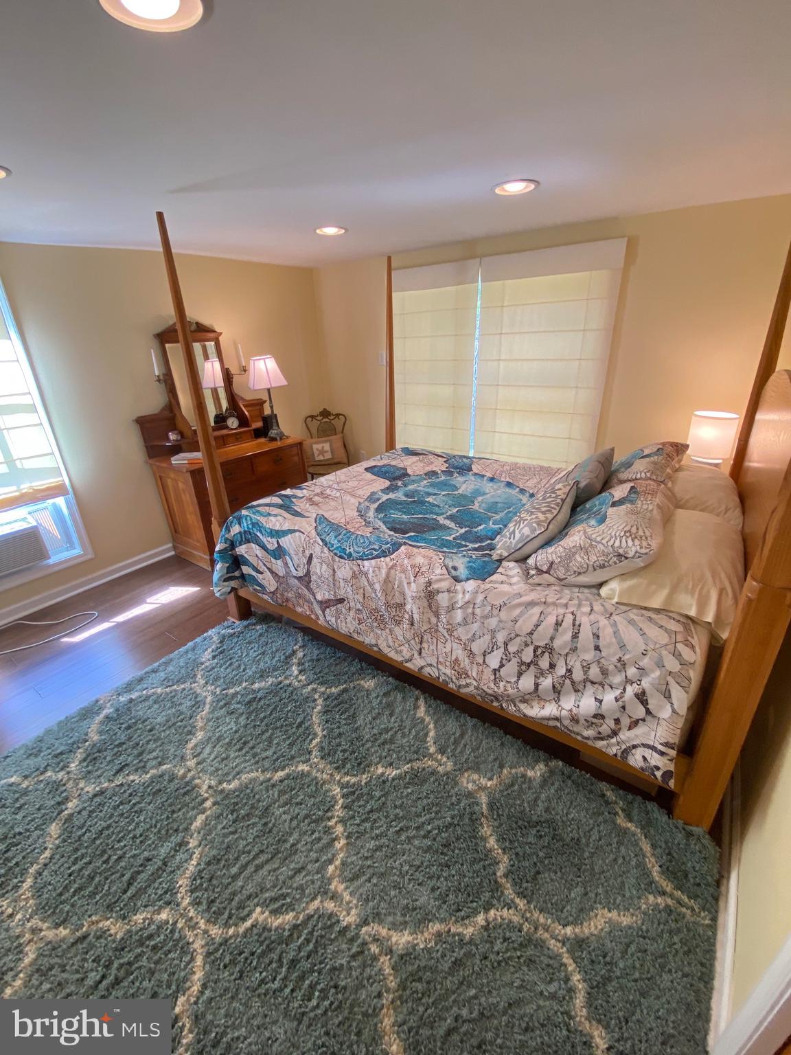 20805 Severn Road Ewell, MD 21824 - Photo 18 of 27 a bed sitting in a room next to a window