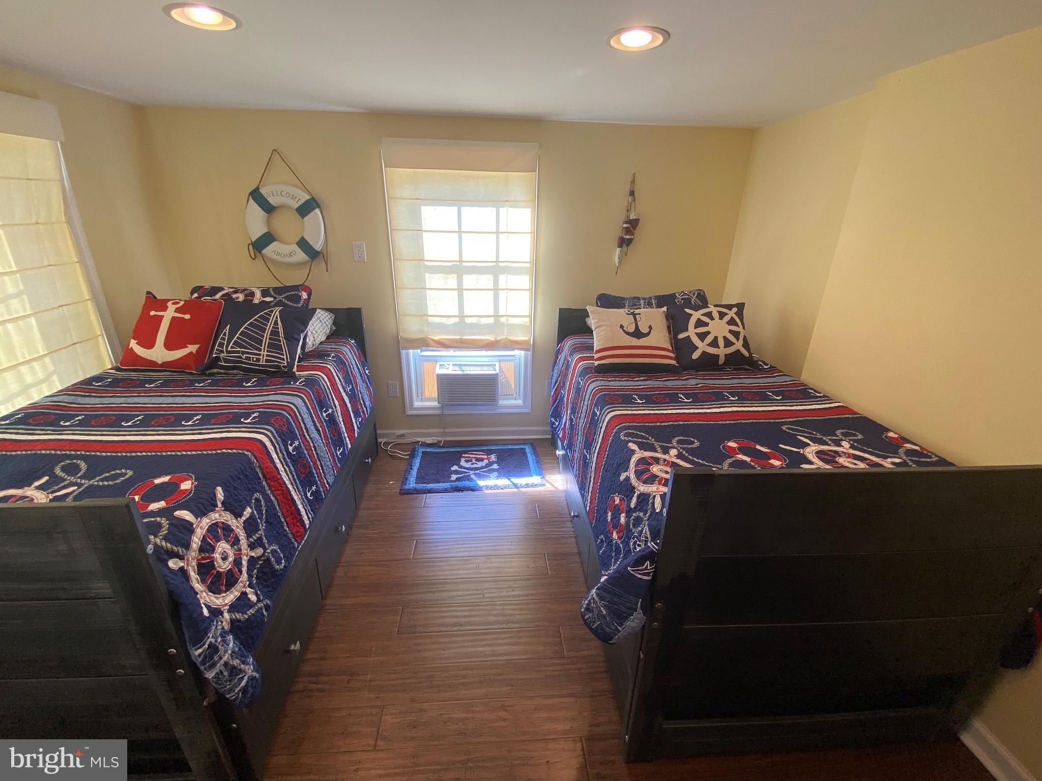 20805 Severn Road Ewell, MD 21824 - Photo 22 of 27 a bedroom with a bed and a window
