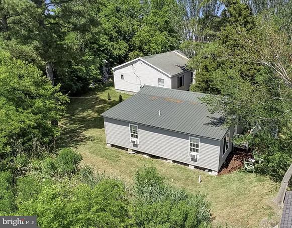 20805 Severn Road Ewell, MD 21824 - Photo 4 of 27 an aerial view of a house with yard and trees in the background