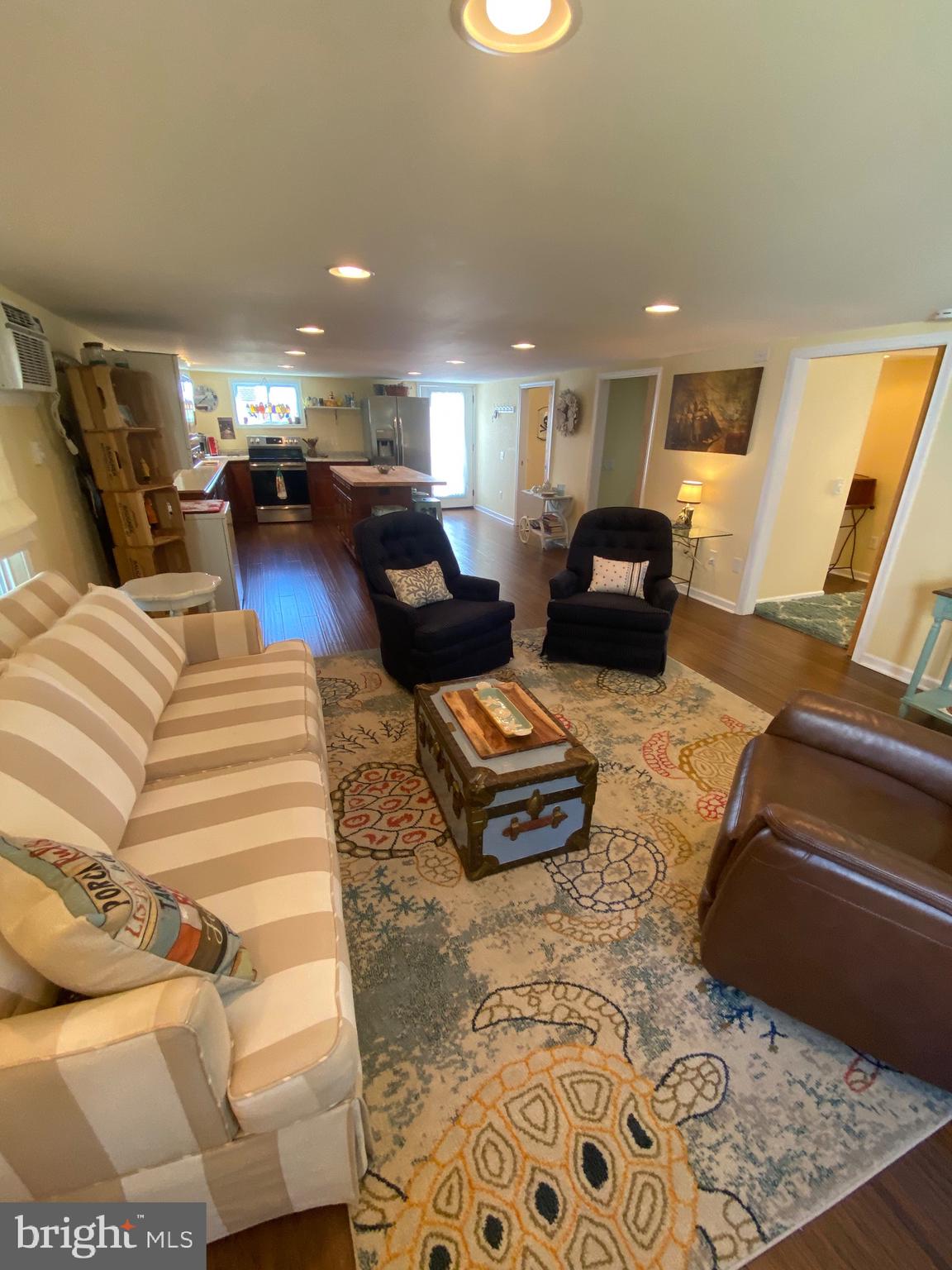 20805 Severn Road Ewell, MD 21824 - Photo 8 of 27 a living room with furniture and a couch