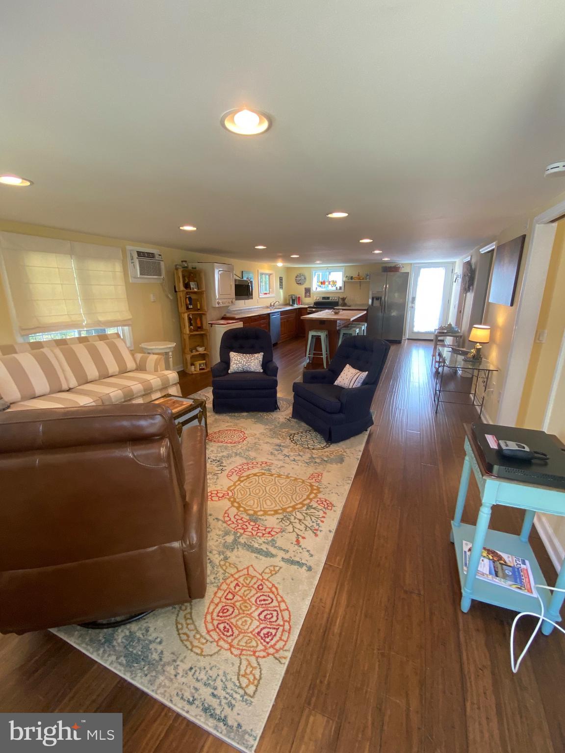 20805 Severn Road Ewell, MD 21824 - Photo 9 of 27 a living room with furniture and a flat screen tv