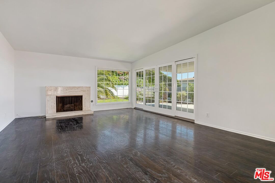 3736 Seahorn Drive Malibu, CA 90265 - Photo 12 of 17 a view of an empty room with wooden floor and a window