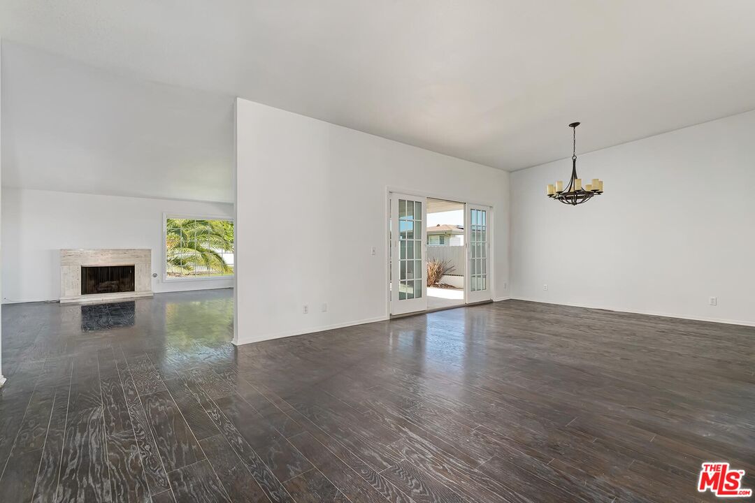 3736 Seahorn Drive Malibu, CA 90265 - Photo 13 of 17 an empty room with wooden floor and windows