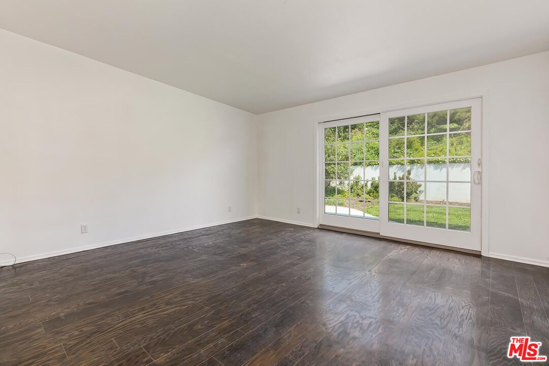 3736 Seahorn Drive Malibu, CA 90265 - Photo 15 of 17 a view of a room with wooden floor and window