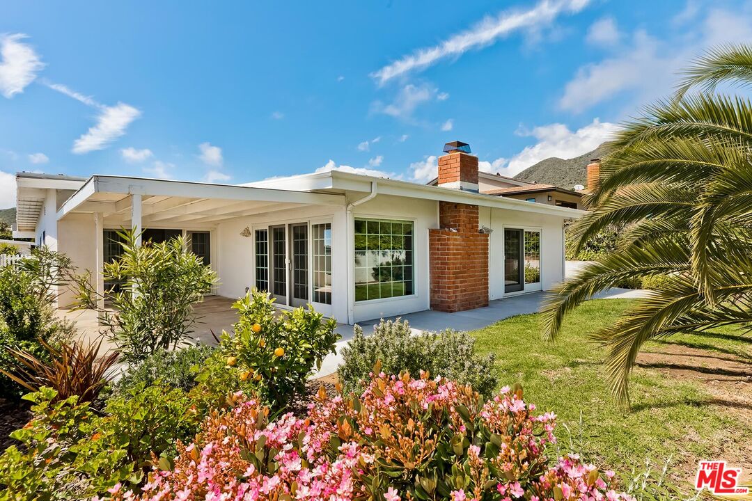 3736 Seahorn Drive Malibu, CA 90265 - Photo 3 of 17 a front view of a house with a garden