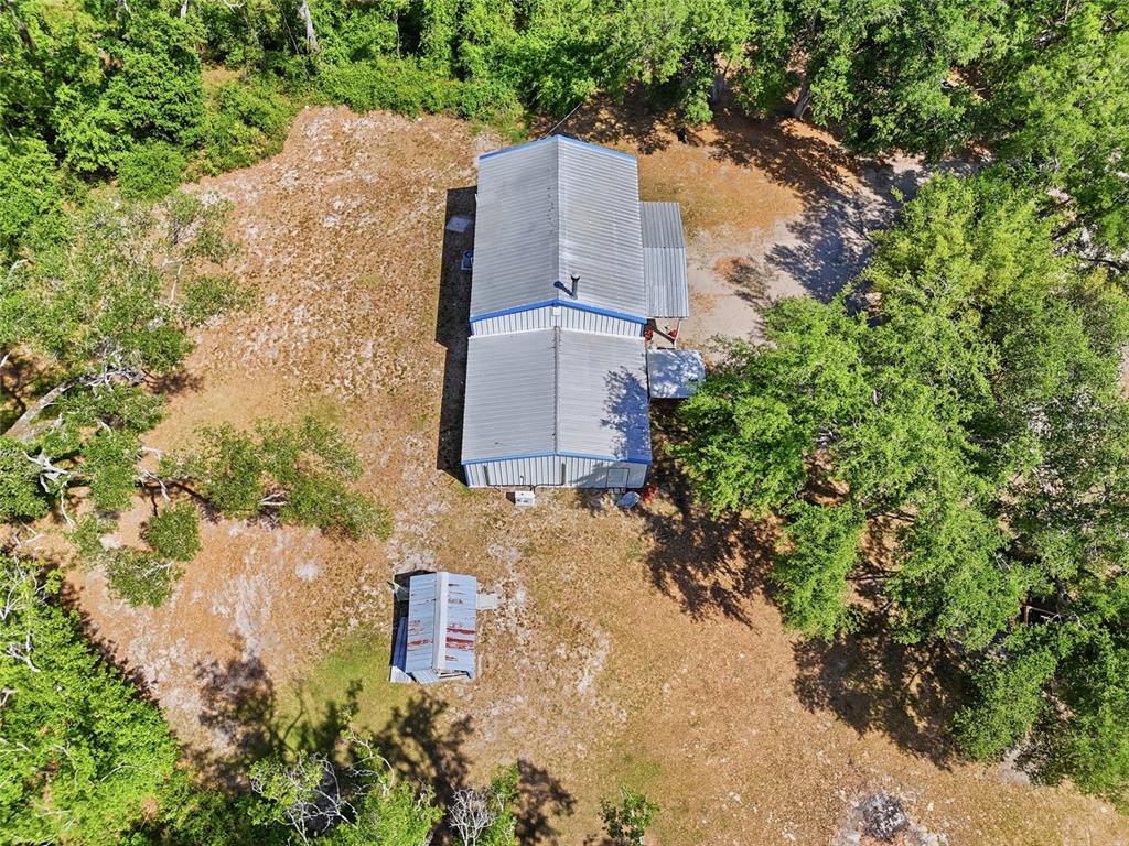 401 Southeast Falcon Road Branford, FL 32008 - Photo 10 of 76 an aerial view of a house with a yard and large trees