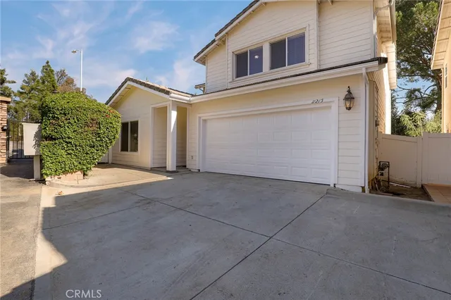 a view of a house with a garage