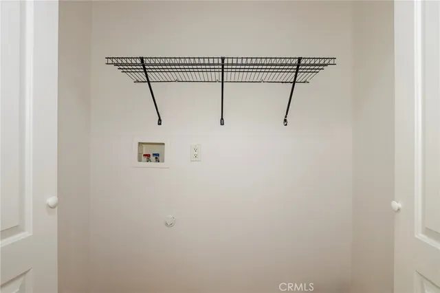 a view of a room with racks on the wall