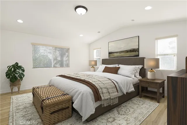 a bedroom with a large bed and a couch