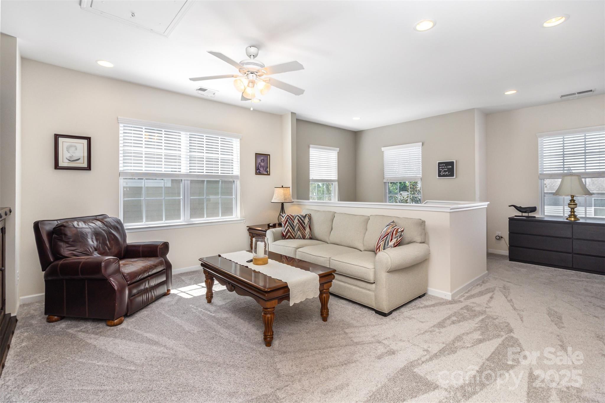 6187 Cloverdale Drive Tega Cay, SC 29708 - Photo 13 of 36 a living room with furniture and a large window
