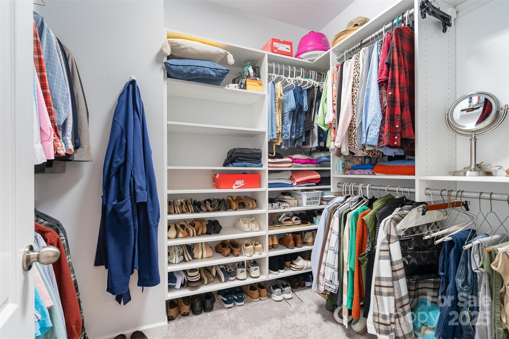 6187 Cloverdale Drive Tega Cay, SC 29708 - Photo 19 of 36 a view of walk in closet with clothes and shoes