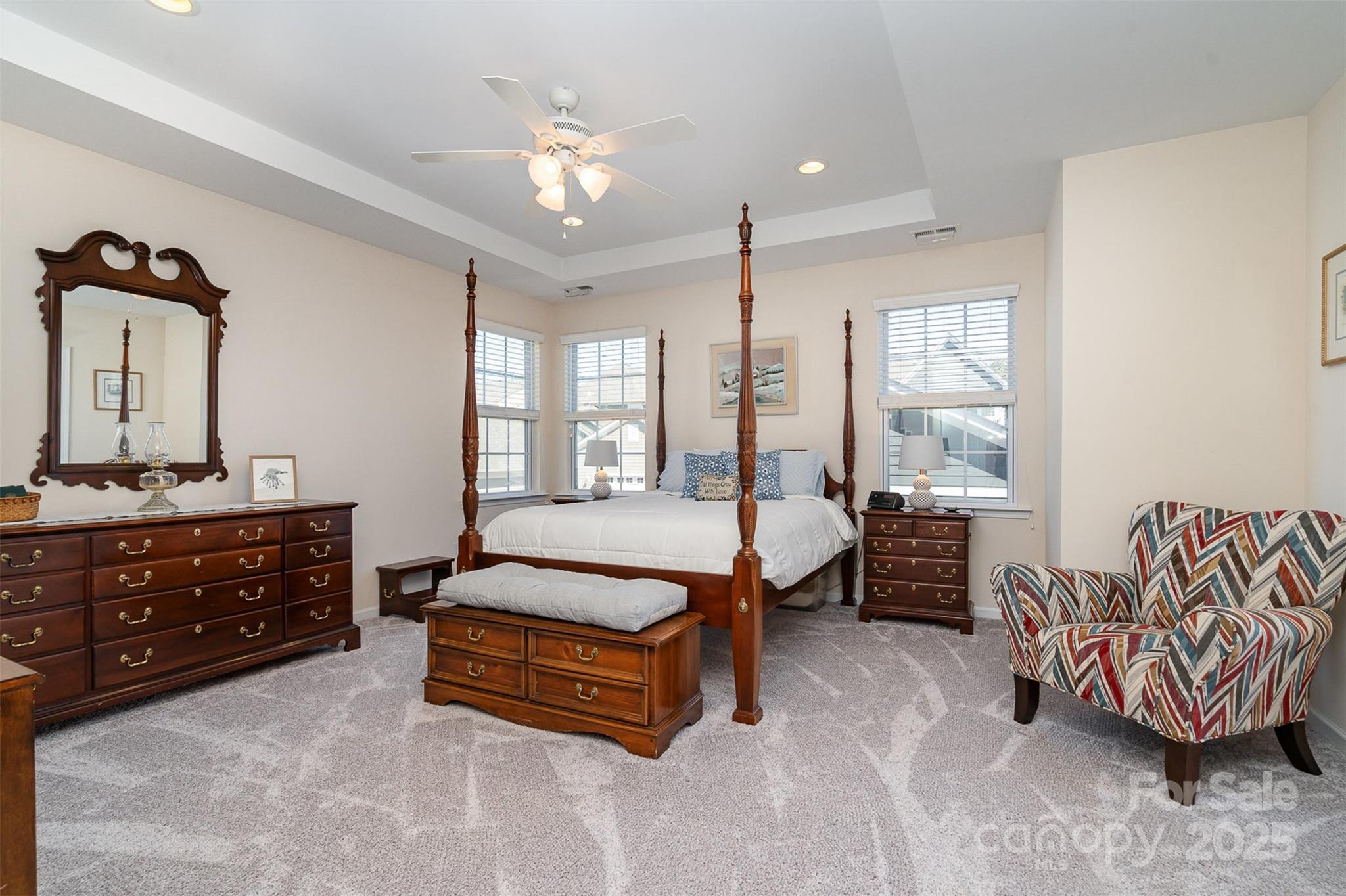 6187 Cloverdale Drive Tega Cay, SC 29708 - Photo 20 of 36 a spacious bedroom with a bed and a dresser