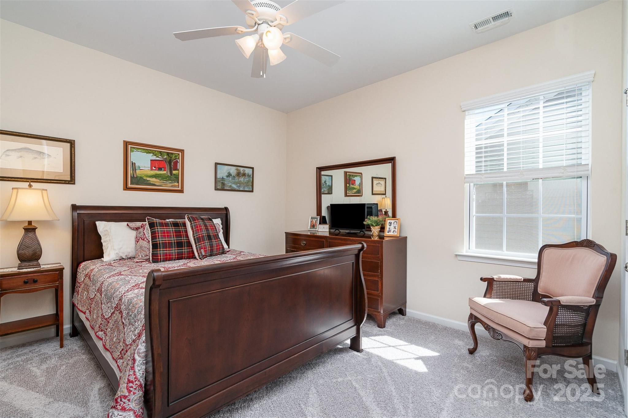 6187 Cloverdale Drive Tega Cay, SC 29708 - Photo 23 of 36 a bedroom with a bed and a chair