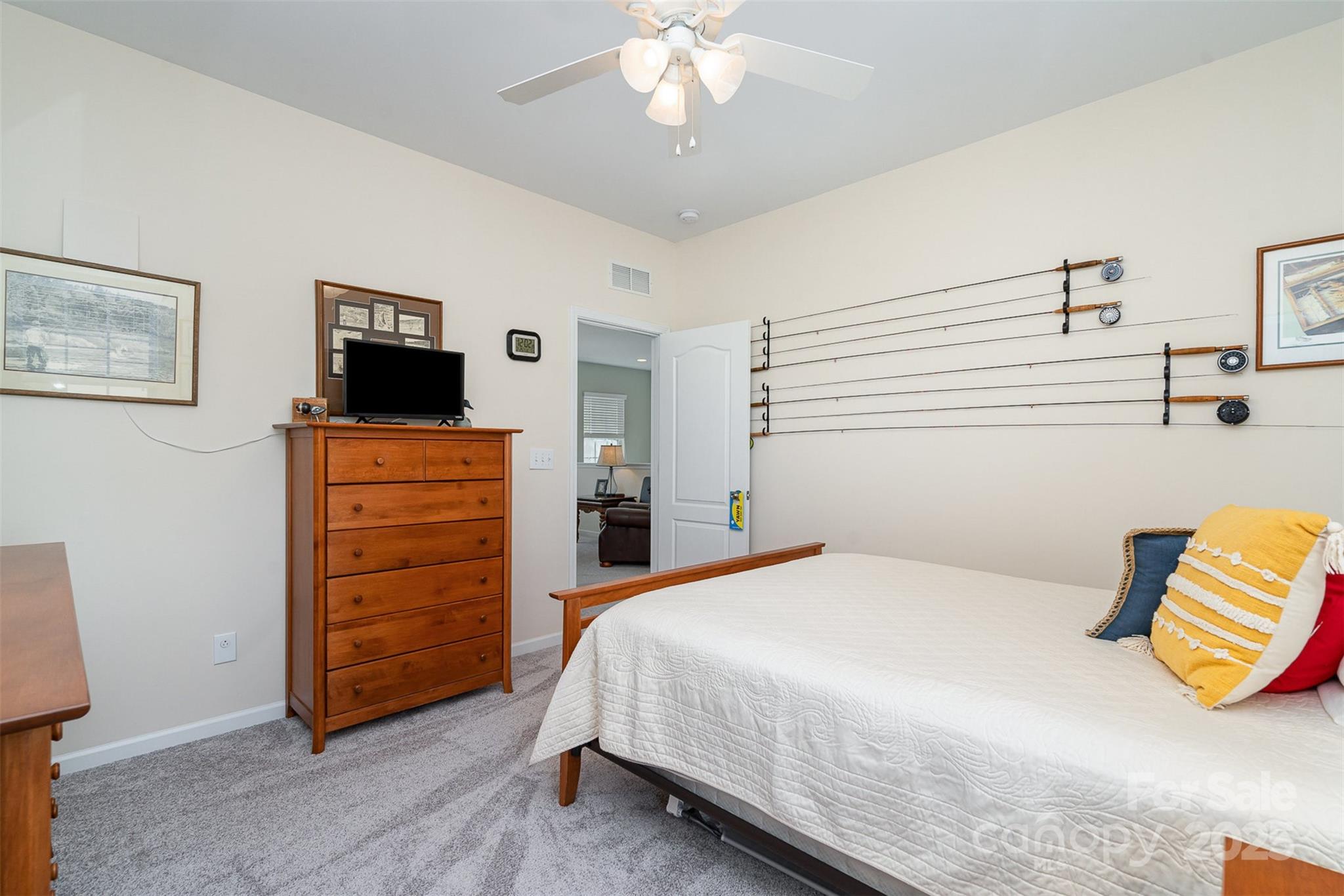 6187 Cloverdale Drive Tega Cay, SC 29708 - Photo 26 of 36 a bedroom with a bed and flat screen tv