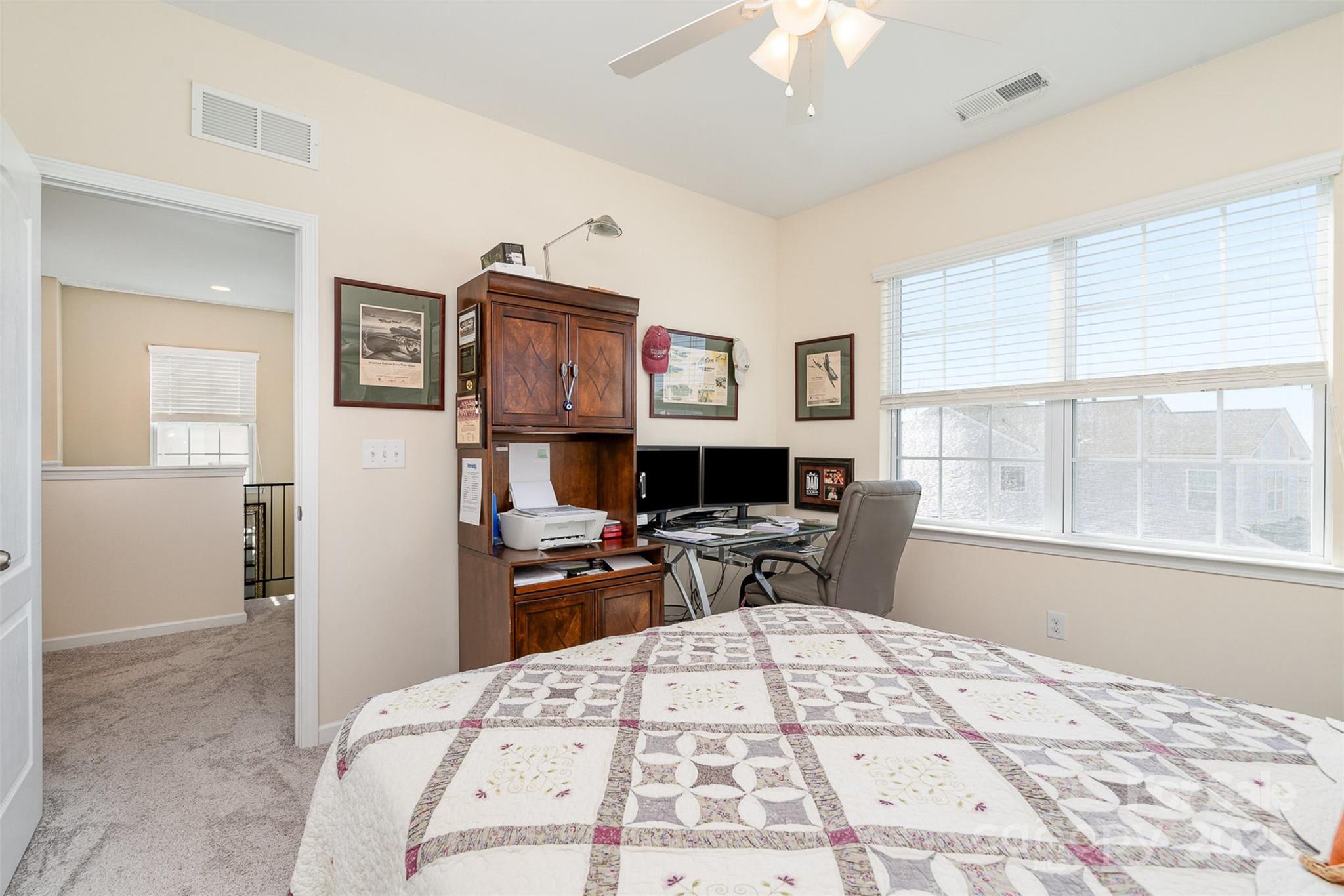 6187 Cloverdale Drive Tega Cay, SC 29708 - Photo 28 of 36 a bed room with a bed and a chair