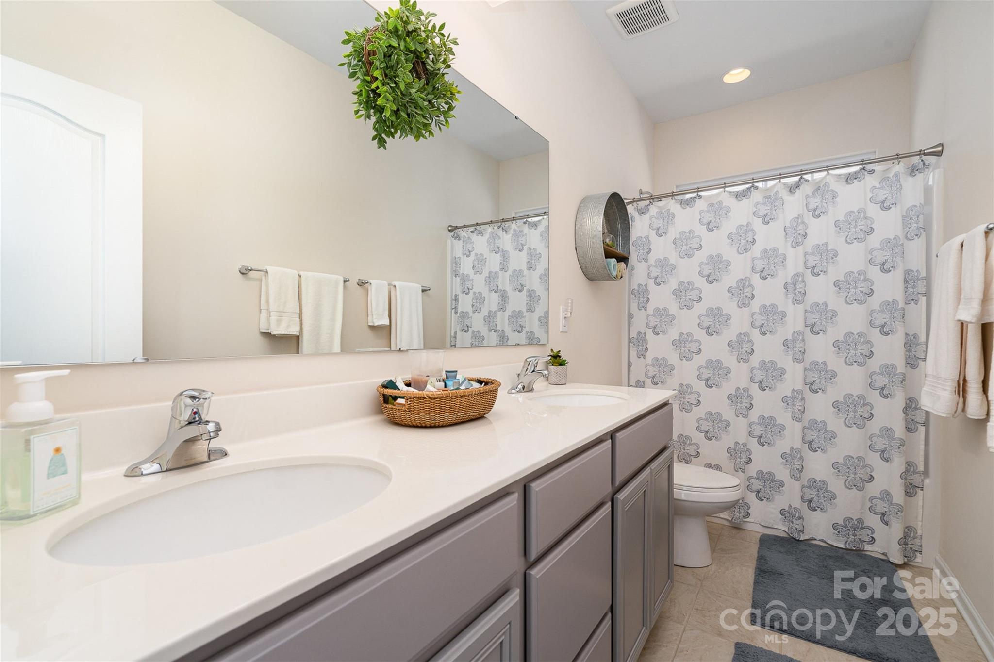 6187 Cloverdale Drive Tega Cay, SC 29708 - Photo 29 of 36 a bathroom with a sink toilet and shower