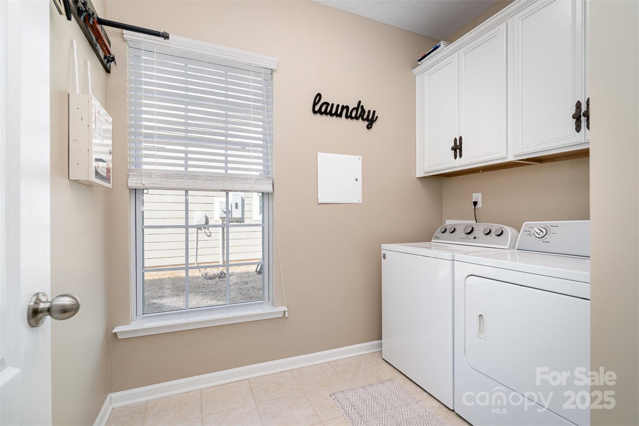 6187 Cloverdale Drive Tega Cay, SC 29708 - Photo 31 of 36 a utility room with dryer and washer