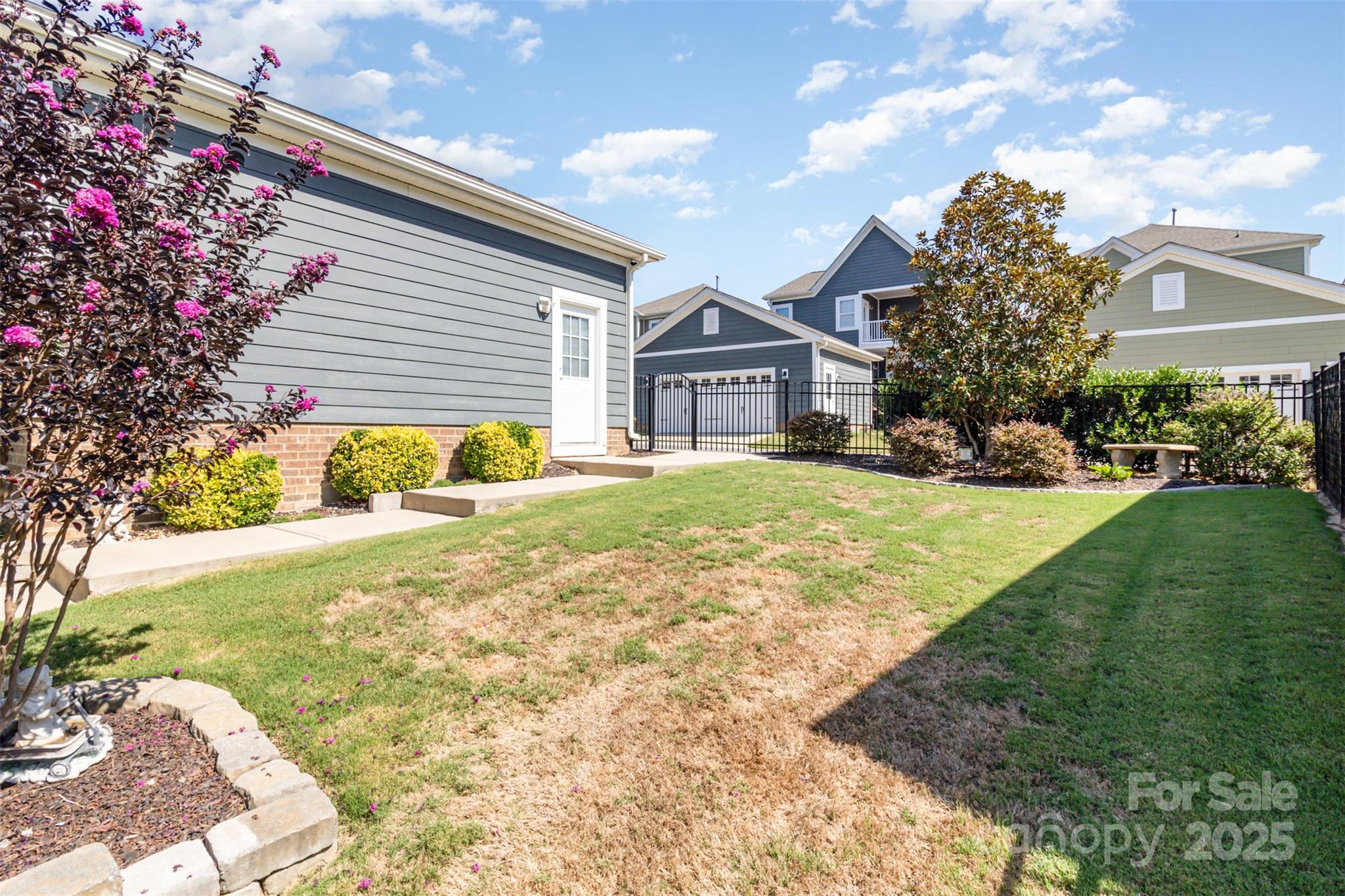 6187 Cloverdale Drive Tega Cay, SC 29708 - Photo 34 of 36 a front view of a house with a yard and garage