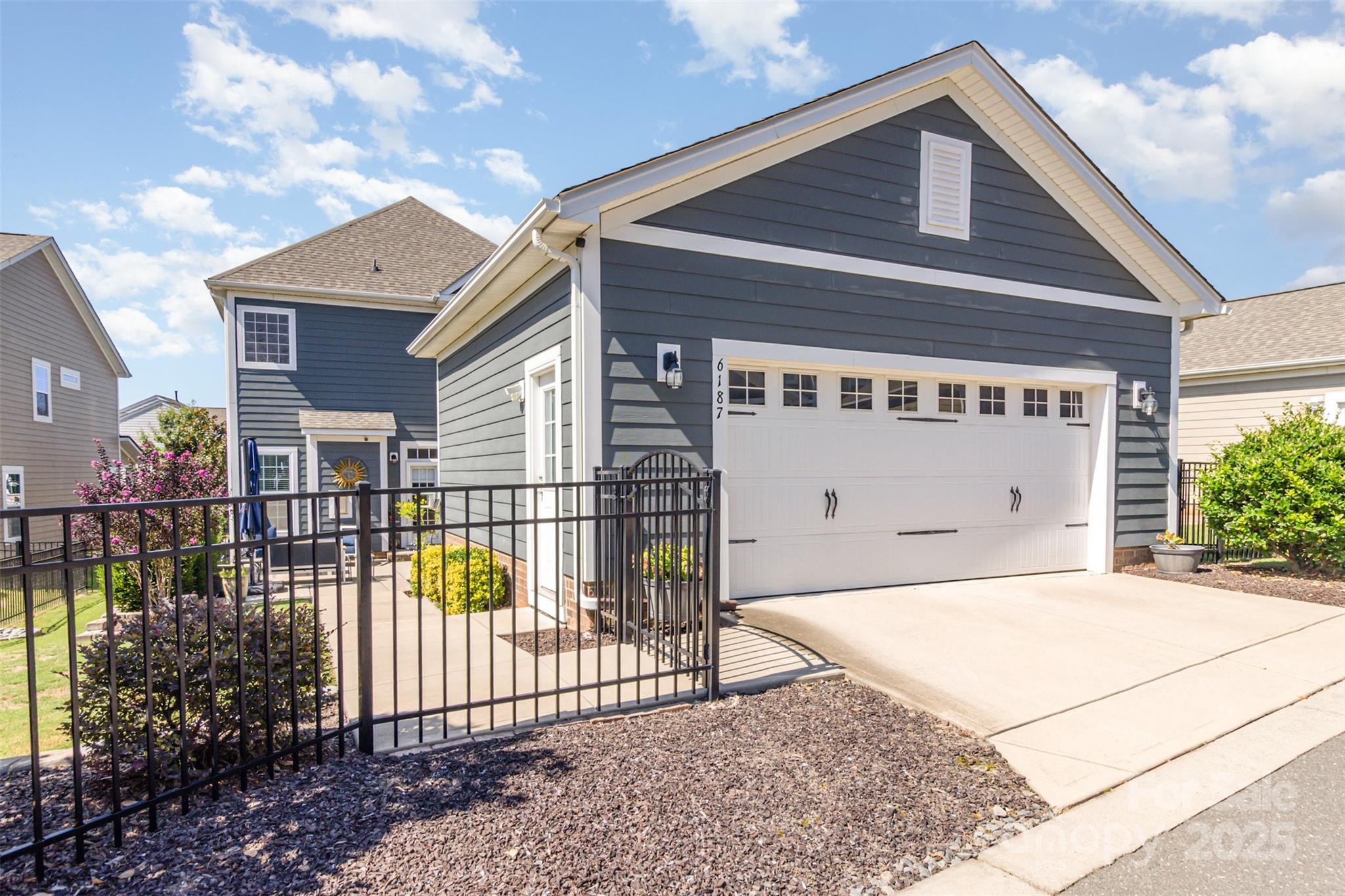6187 Cloverdale Drive Tega Cay, SC 29708 - Photo 35 of 36 a front view of a house with balcony