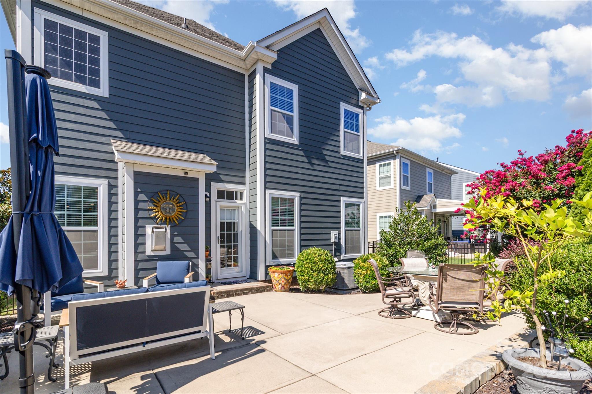 6187 Cloverdale Drive Tega Cay, SC 29708 - Photo 36 of 36 a view of house with backyard and sitting area