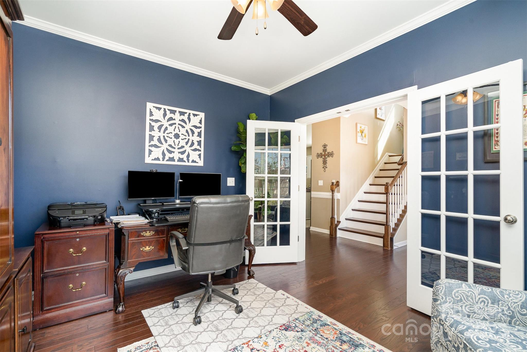 6187 Cloverdale Drive Tega Cay, SC 29708 - Photo 6 of 36 a view of a workspace with furniture and a window
