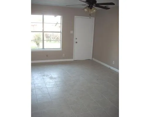 a view of a room that has a window in it