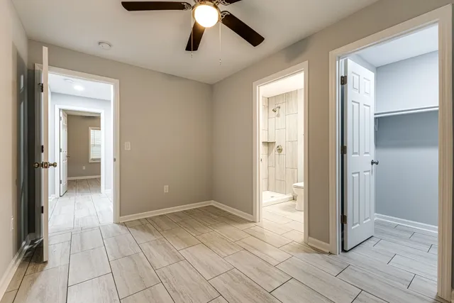 a bathroom with a toilet a sink and shower