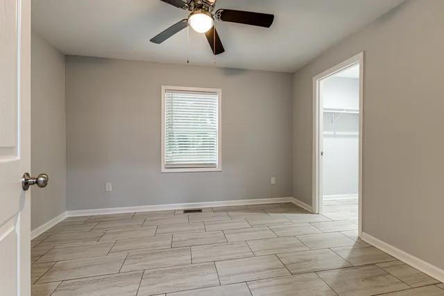 a bathroom with a shower and toilet