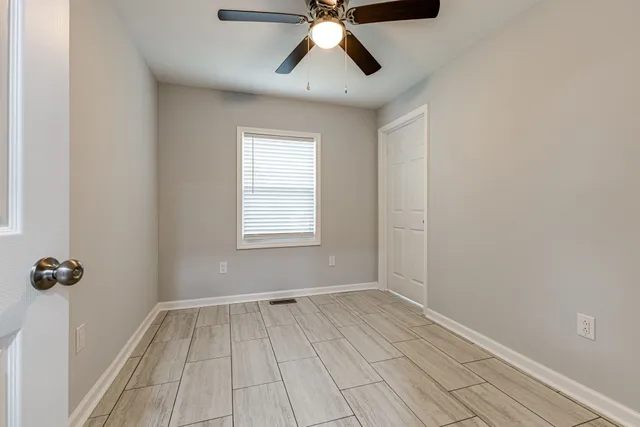 a view of a kitchen with a sink and a refrigerator