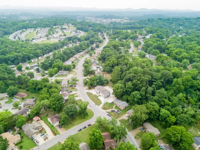 a bathroom with a toilet and shower