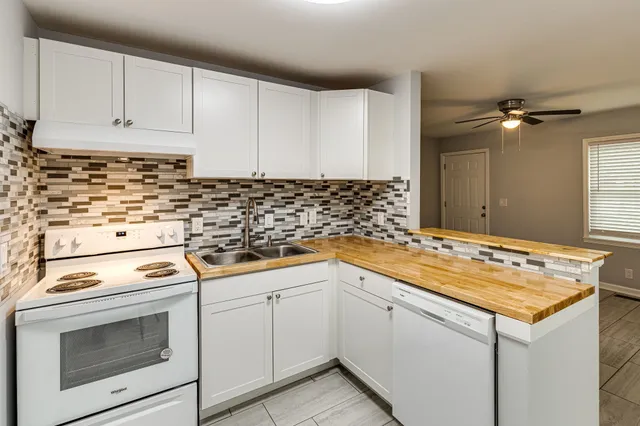 a view of a hallway to rooms