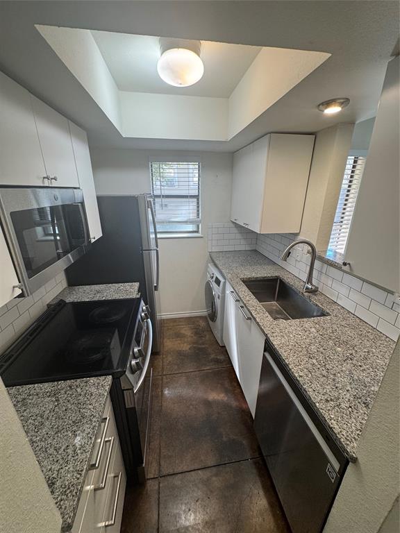 a kitchen with a stove and a sink