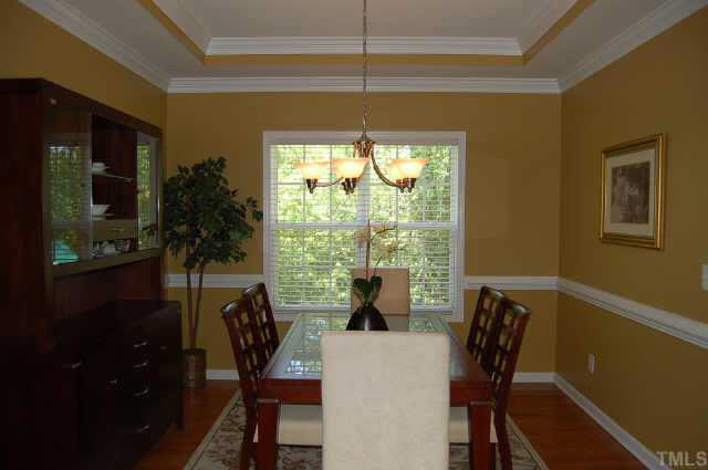132 Mickleson Ridge Drive Raleigh, NC 27603 - Photo 3 of 10 a view of a dining room with furniture window and outside view