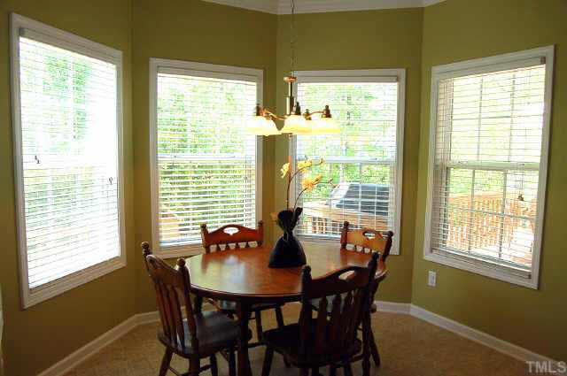 132 Mickleson Ridge Drive Raleigh, NC 27603 - Photo 5 of 10 a view of a dining room with furniture and windows