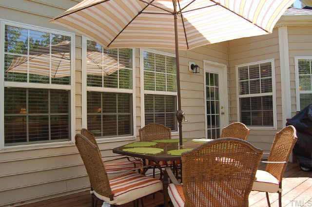 132 Mickleson Ridge Drive Raleigh, NC 27603 - Photo 7 of 10 a backyard of a house with table and chairs