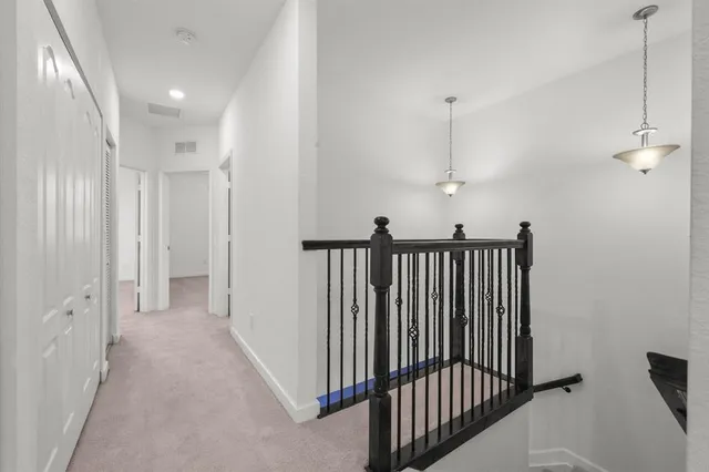 a view of a hallway with entryway