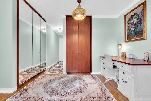 a very nice looking room with a large bed and a chandelier