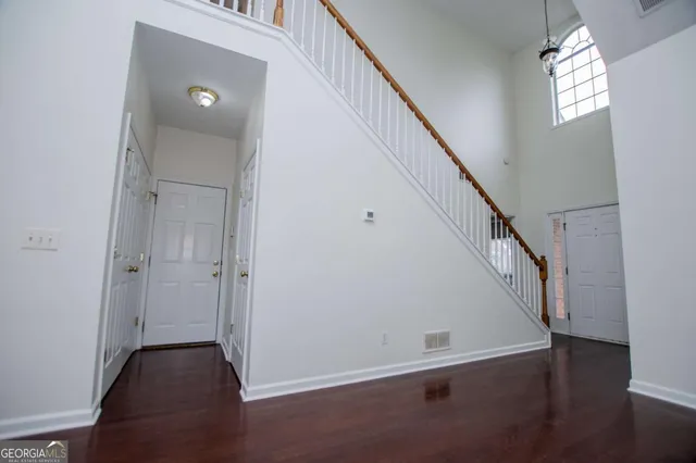 a view of entryway with wooden floor