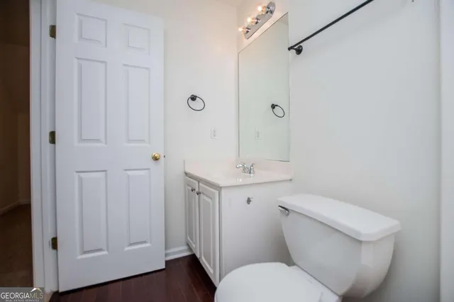 an empty room with a ceiling fan and a window