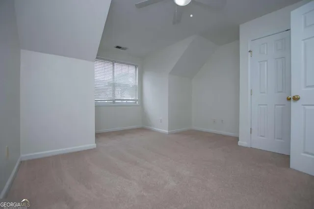 an empty room with white cabinet