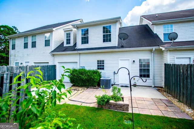 an aerial view of residential house with outdoor space and swimming pool