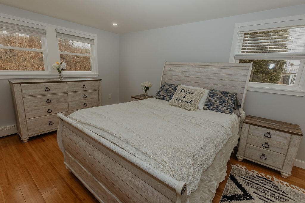 9 Rip Van Winkle Way Buzzards Bay, MA 02532 - Photo 11 of 56 a bedroom with a bed and a window